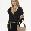 Bolso de mano pequeño tipo pulsera en piel granulada Bolso de mano pequeño tipo pulsera en piel granulada