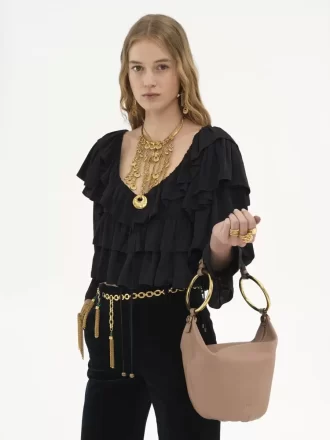Bolso de mano pequeño tipo pulsera en piel granulada Bolso de mano pequeño tipo pulsera en piel granulada