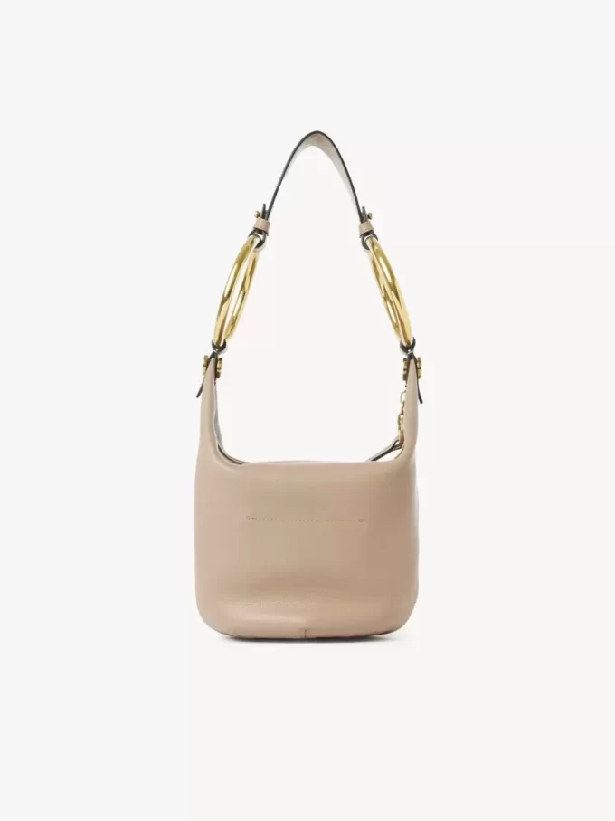 Bolso de mano pequeño tipo pulsera en piel granulada Bolso de mano pequeño tipo pulsera en piel granulada