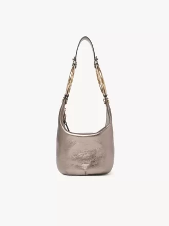 Bolso de mano pequeño tipo pulsera en piel metalizada Bolso de mano pequeño tipo pulsera en piel metalizada