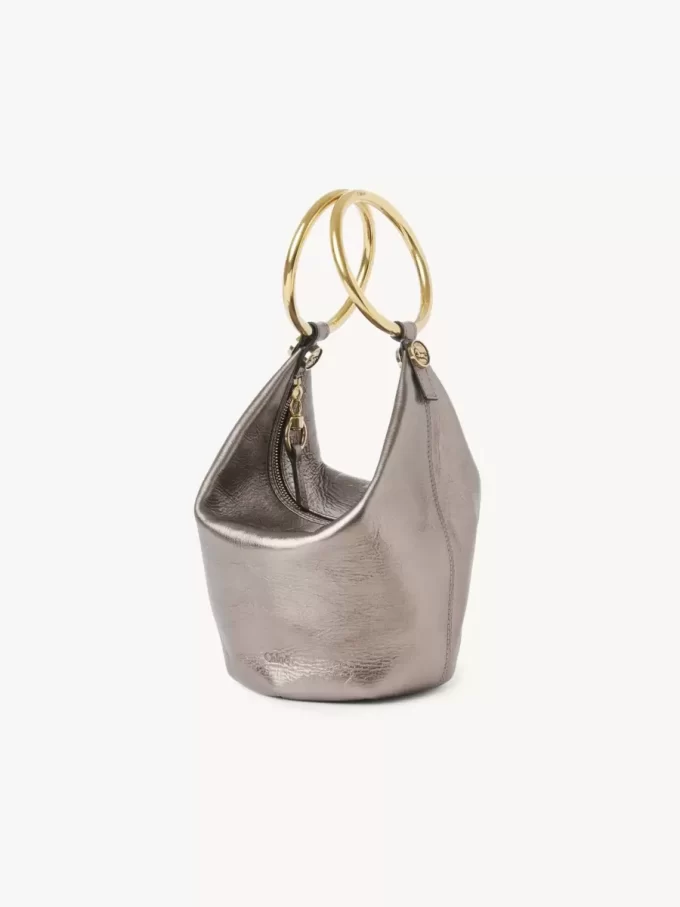 Bolso de mano pequeño tipo pulsera en piel metalizada Bolso de mano pequeño tipo pulsera en piel metalizada