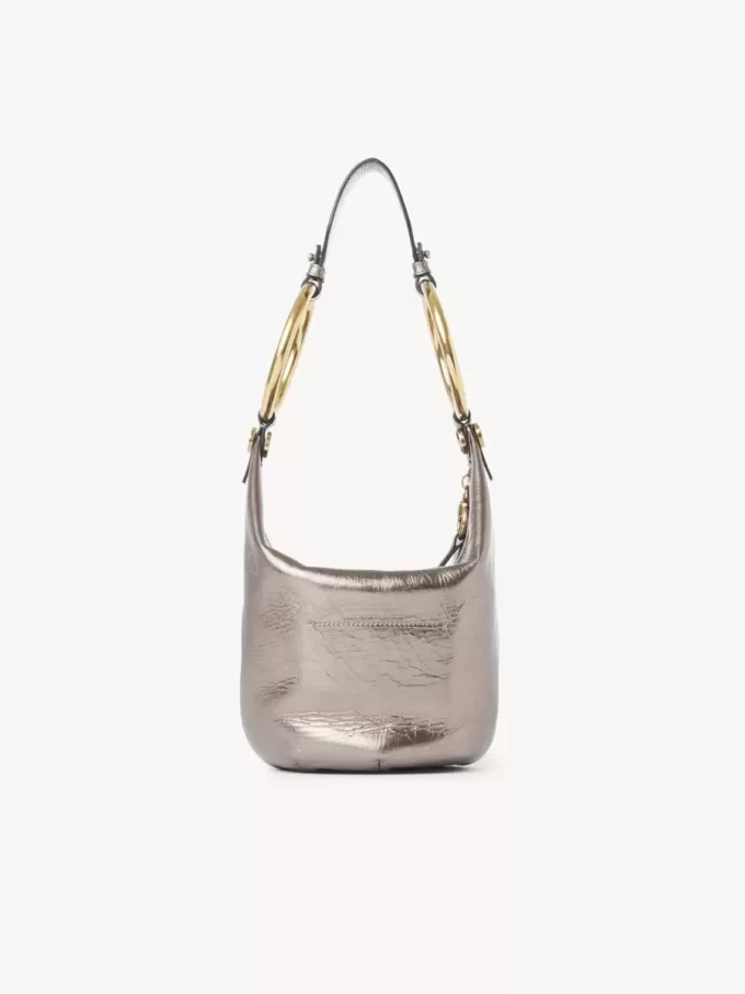 Bolso de mano pequeño tipo pulsera en piel metalizada Bolso de mano pequeño tipo pulsera en piel metalizada