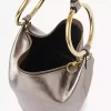 Bolso de mano pequeño tipo pulsera en piel metalizada Bolso de mano pequeño tipo pulsera en piel metalizada