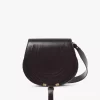 Bolso de sillín Marcie en piel brillante Bolso de sillín Marcie en piel brillante