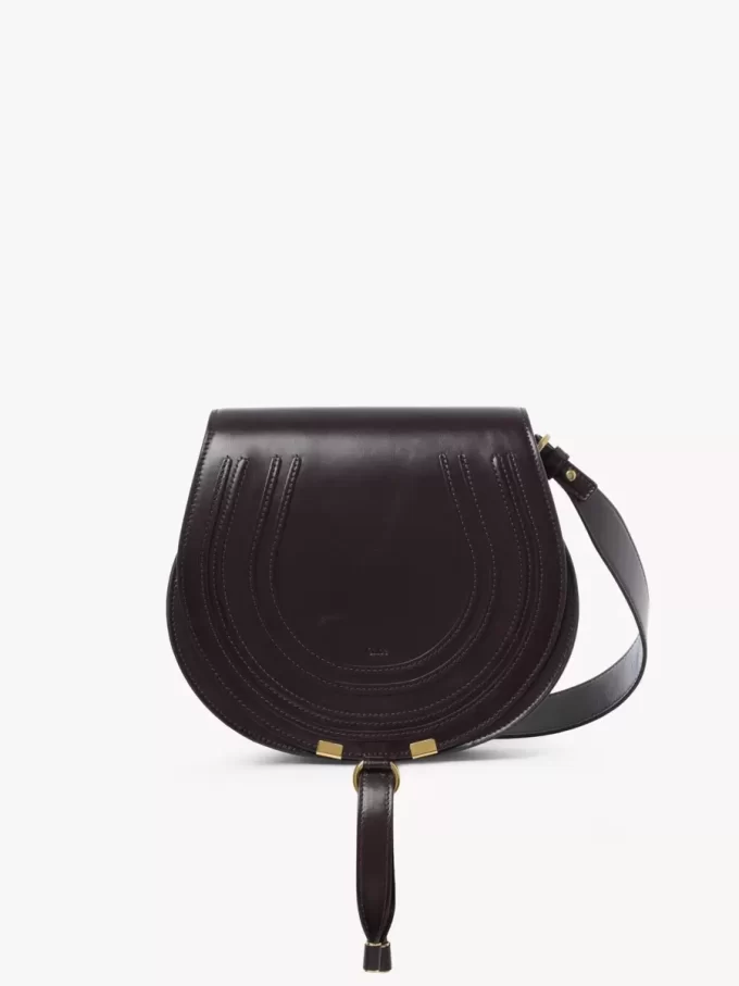 Bolso de sillín Marcie en piel brillante Bolso de sillín Marcie en piel brillante