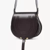 Bolso de sillín Marcie en piel brillante Bolso de sillín Marcie en piel brillante