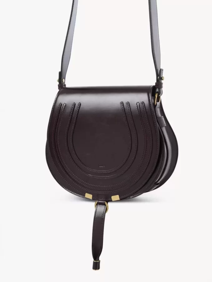 Bolso de sillín Marcie en piel brillante Bolso de sillín Marcie en piel brillante