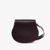 Bolso de sillín Marcie en piel brillante Bolso de sillín Marcie en piel brillante