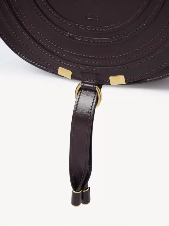Bolso de sillín Marcie en piel brillante Bolso de sillín Marcie en piel brillante