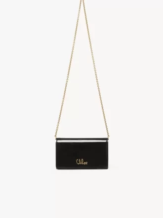 Cartera con solapa y cadena Chloé Iconic en charol Cartera con solapa y cadena Chloé Iconic en charol