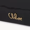 Cartera con solapa y cadena Chloé Iconic en charol Cartera con solapa y cadena Chloé Iconic en charol