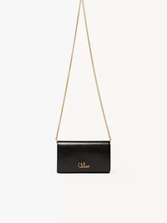 Cartera con solapa y cadena Chloé Iconic en piel brillante Cartera con solapa y cadena Chloé Iconic en piel brillante