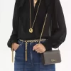 Cartera con solapa y cadena Chloé Iconic en piel brillante Cartera con solapa y cadena Chloé Iconic en piel brillante