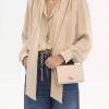 Cartera con solapa y cadena Chloé Iconic en piel brillante Cartera con solapa y cadena Chloé Iconic en piel brillante